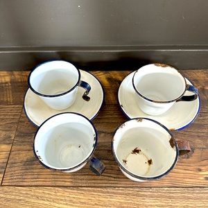 Vintage enamelware cups and saucers.